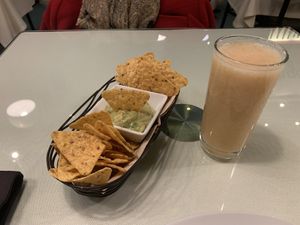 Nachos with pear juice at Organi Chiado in Lisbon