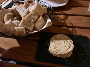 Homemade fermented cashew cheese and rice bread at Organi Chiado in Lisbon