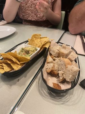 Guacamole and chips and bread with vegan cheese  at Organi Chiado in Lisbon