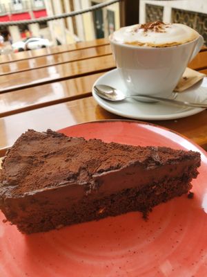 Chocolate cake and cappuccino at Organi Chiado in Lisbon
