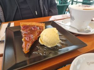 Salty caramel Pecanut cake with vanilla ice cream. at Organi Chiado in Lisbon