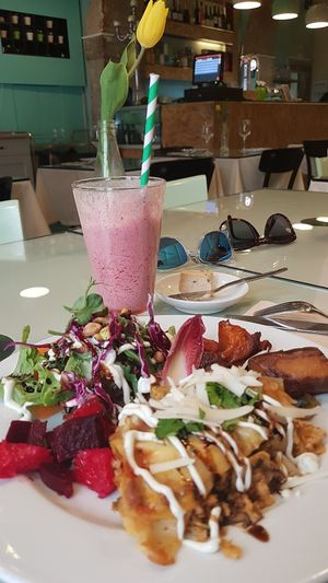 Lasagna with delicious sides! at Organi Chiado in Lisbon