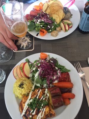 Chickpeas burger with homemade fries and quinoa (top), marinaded tofu with saffron rice (below) - lunch menu at Organi Chiado in Lisbon