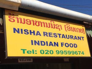 Sign from street at Nisha Restaurant  in Phonsavan