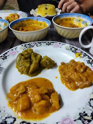 Potatoes with spinach, dal and eggplant at Nisha Restaurant  in Phonsavan