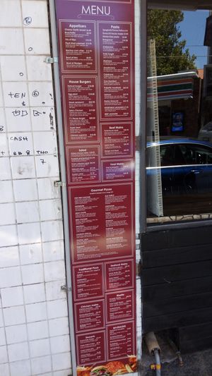 Menu with animal parts and secretions! at Mr Natural Vegetarian Pizza in St Kilda