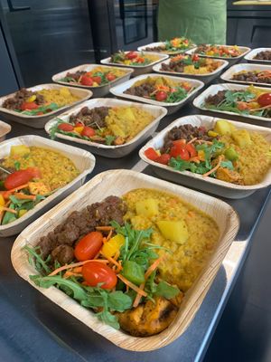Hot meal with Maple jerk TVP/ Soya chunks, coconut lentil & potato stew, organic salad & turmeric rice served on palm bowls. at Chic Peas Veg in Toronto
