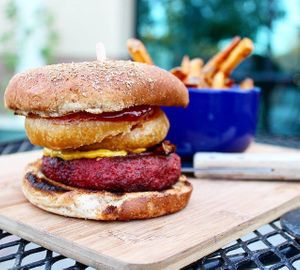 This Vegan Revenant Burger will blow your mind! Vegan Mushroom Bacon, Cashew Based Onion Ring, Vegan BBQ Sauce, House-Made Cashew Cheese, & Beyond Meat Burger! at The Blaq Square in Valencia