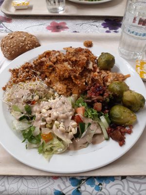 Lasagna, lemon brussel sprouts, salad with delicious tamari sauce at Kasvis Ravintola  in Turku