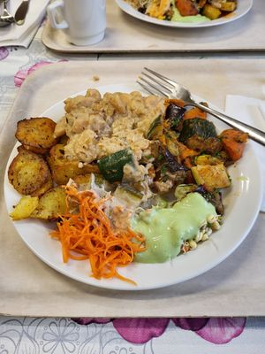 BBQ potatoes, BBQ vegetables, lemon bean sauce. Carrots and sprouts. at Kasvis Ravintola  in Turku