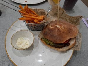 Veg burger with sweet potato fries and vegan mayo at Al Lampione in Gorizia