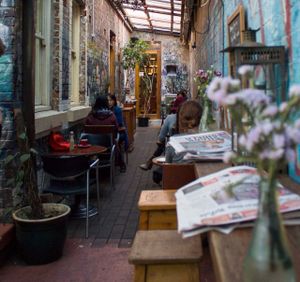 Between Bookstore & Courtyard at Sappho Books Cafe & Bar in Glebe