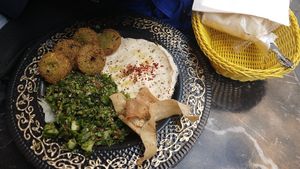 I believe this is menu 3. With Tabouleh, hummus, falafel, and i forgot the name of the other thing. Comes with 2 large pitas to deep. at Falafel Koy in Istanbul