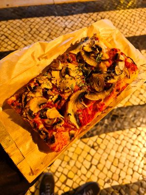 Funghi pizza slice at Romana Pizza in Lisbon