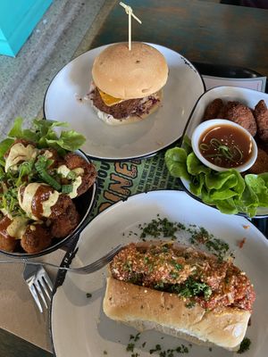 Gnome Nugs (vegan nuggets), Demon Drummies (crumbed cauliflower), The Phoenix (southern fried vegan chicken), and Garlic Bread Meatball Sub at Netherworld in Fortitude Valley