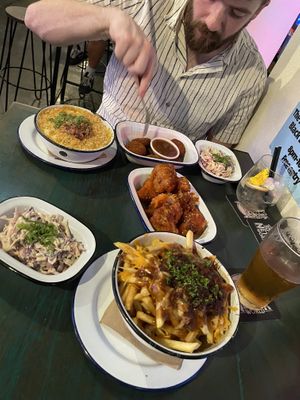 Poutine, coleslaw, mac n cheese, vegan nuggets, and cauliflower wings  at Netherworld in Fortitude Valley