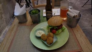 Beet veggie burger with falafel and beer. at JustVeggie in Siracusa
