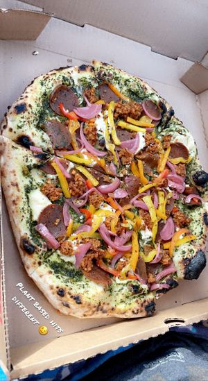 Pesto pizza with pepperoni, sausage, onions & peppers!   at Floralia in Honolulu