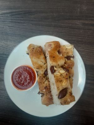 Focaccia with garlic and olives. I thought it was too soft. at Floralia in Honolulu