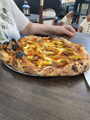 Our fresh out of the pizza oven vegan pizza!  at Floralia in Honolulu