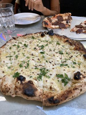 White Pizza (front) and Pepperoni (back)  at Floralia in Honolulu