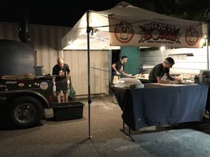 The tent and mobile wood stove where you order and they make the pizza at Floralia in Honolulu
