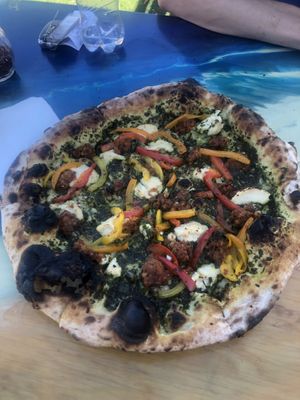 Pesto pizza with “goat” cheese, sausage, and peppers! at Floralia in Honolulu