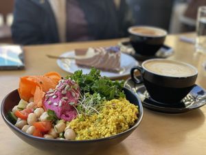 Buddha bowl, latte coffee and zebra cake  at The Vegan Fairies in Nea Erythraia