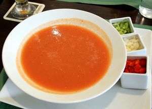 Gazpacho with condiments. at Green Bar in Malaga