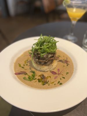 Wild Mushroom Risotto Cake
topped with seasonal wild mushrooms, creamy cep sauce, rocket & lemon truffle dressing  at The Gate - Marylebone in London