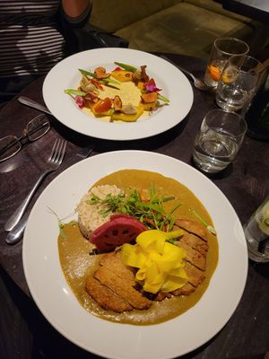 Katsu curry in front, gnocchi in back. at The Gate - Marylebone in London