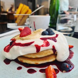 Berry pancakes with polenta fries in background at The Gate - Marylebone in London
