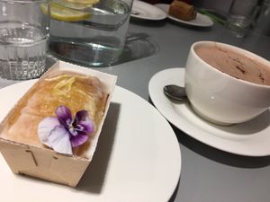 Vegan lemon drizzle cake with almond milk hot chocolate!  at Kindness and Co in Cheltenham