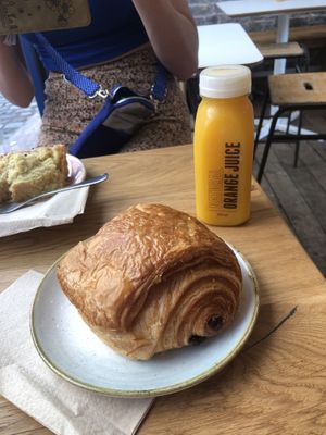 Pain au chocolate and OJ.  at The Fields Beneath - Kentish Town in North West London