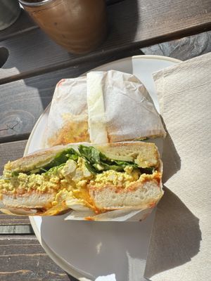 Scrambled tofu + sriracha Bagel  at The Fields Beneath - Kentish Town in North West London