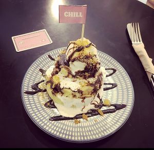 Pancakes with vanilla ice cream and a message to live by!  at Chillin' Cafe in Madrid