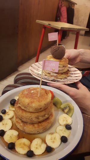 Pancakes with fruit and syrup. at Chillin' Cafe in Madrid