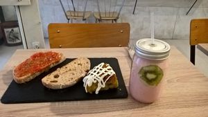 Banana and strawberry smoothie,Spanish tortilla and tomato toast  at Chillin' Cafe in Madrid