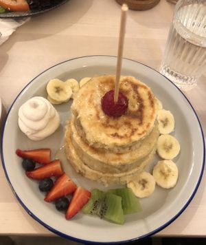 Pancakes with fruit and vegan cream.  at Chillin' Cafe in Madrid
