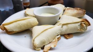 Sambussa de espinafre (R$25). Dough was slightly too thick. Spinach interior had a creamy flavor I didn't love. at Congolinaria - Alfonso Bovero in Sao Paulo