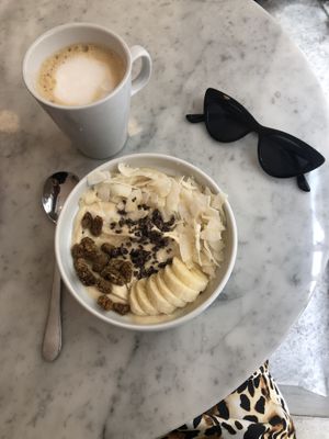Latte with homemade almond milk and PB smoothie bowl. at Love Juice Bar in Paris