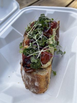 Blistered tomato tartine with cashew cheese and pesto - vegan  at The Heart Cafe in Bragg Creek