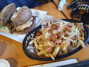 Cheese hotdog fries and the dark and crispy Burger at Vegan Place in Vina Del Mar