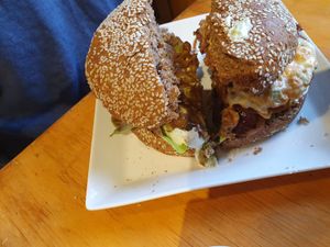 Half of the Crispy Burger (left), Dark Burger (right) at Vegan Place in Vina Del Mar