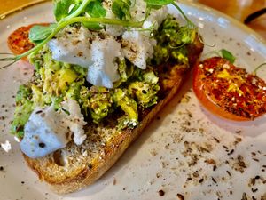 Toasted sourdough with avocado, vegan feta, roast tomato and dukkah herbs at The Ceilidh Place in Ullapool