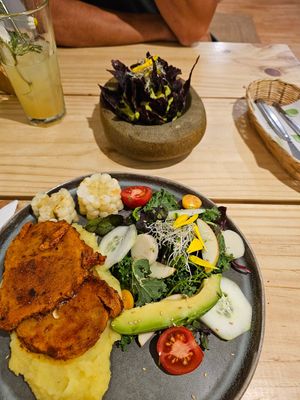 Vegan steak, mashed potatoes and salad. Guacamole in the background. at Vida Vegan Bistro in Cusco