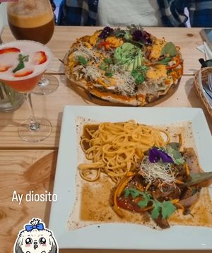 Pizza y fideos en huancaina at Vida Vegan Bistro in Cusco