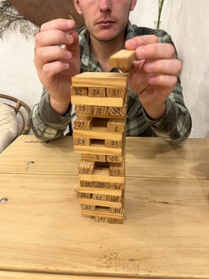 Games while you wait   at Vida Vegan Bistro in Cusco