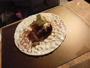 Vegetarian chocolate brownie with vanilla ice cream at Naar RestoBar in St Julians