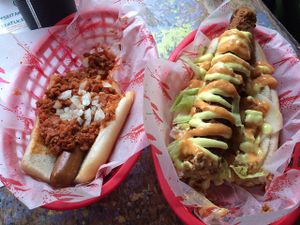 Half eaten chilli dog and Kentucky fried doggo.  at Larder in Brighton